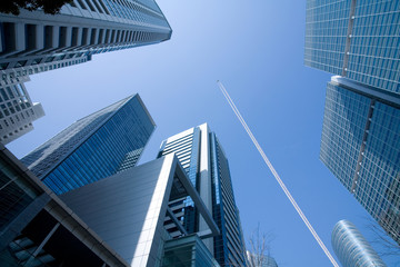 Office Building  and the high flying passenger plane with a cont