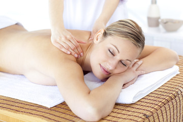 Obraz na płótnie Canvas Positive woman having a back massage