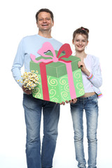 Father and daughter holding a present