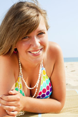 smiling young woman on the beach