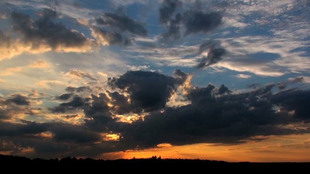 time lapse of clouds during sunset