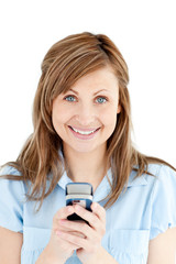 Fototapeta premium Positive businesswoman texting smiling at the camera
