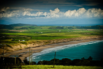 colourful view of welsh coastline beach and fields