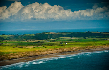colourful view of welsh coastline beach and fields
