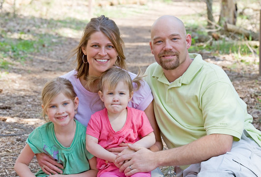 Couple With Their Daughters