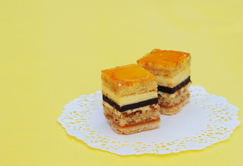 Fine fruit cakes, on lace paper, shallow dof