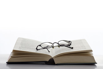 Book and reading glasses