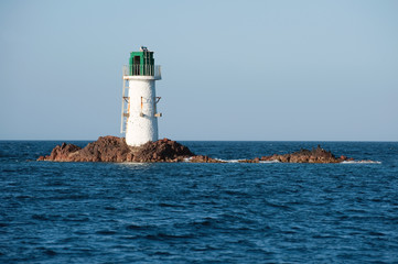 Obraz premium Pecorella lighthouse located on a rock, Corsica