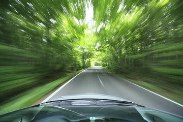 Fotobehang Snelle auto car driving fast into forest