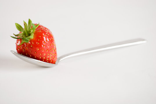 strawberry on spoon