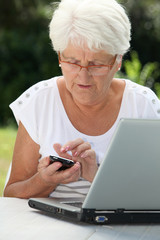 Elderly woman using internet