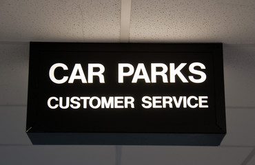 modern sign for car park and customer service