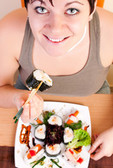woman eating sushi
