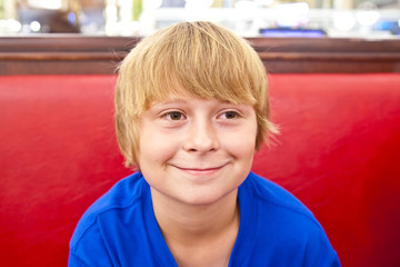 smiling boy in a diners at night