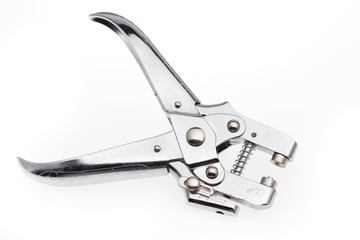 A shiny metal pop rivet tool isolated on a white background