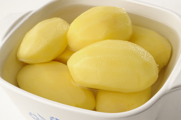 peeled potatos in a bowl
