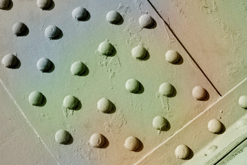 Metal rivets at old construction