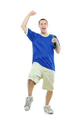 Excited football fan with a beer in his hand watching sport