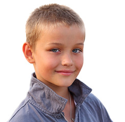 Photo of happy young boy looking at camera on white background