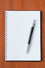 black pen and notebook
