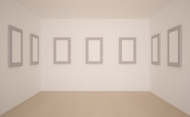 white empty room with frames on a wall