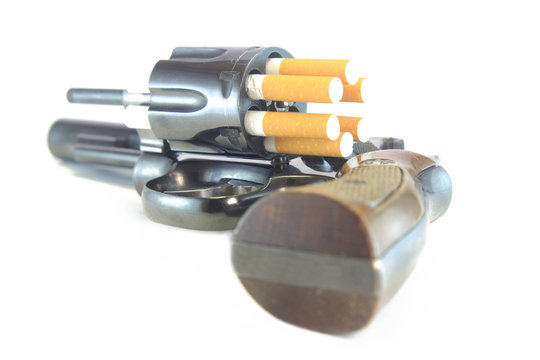 Revolver loaded with cigarettes symbolize dangers of smoking