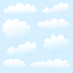 nuages de dessin animé contre le ciel bleu