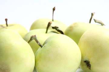 Green apples on white background