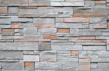 Wall murals Stones Square stone wall close up