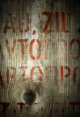 Old wood texture with typography elements.