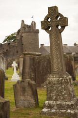 Fototapeta na wymiar Celtic cross at a churchyard