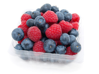 transparent basket with a raspberry and a blueberry