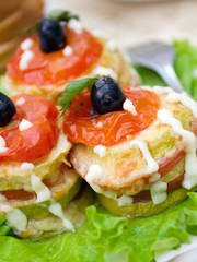 Canape with ham, joint,tomat