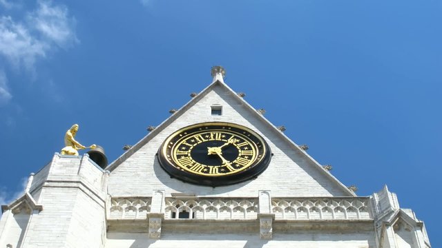 Time lapse clock at church tower in Leuven, Belgium