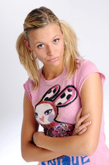Atractive blonde woman in pink T-shirt with two plaits