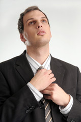 Young worried manager in black suit