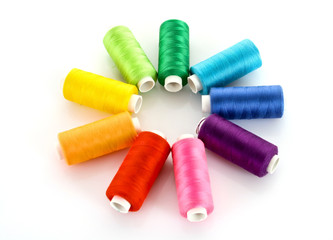 Few bobbins isolated on white