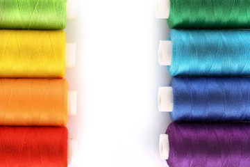 Few bobbins isolated on white