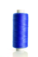 Blue bobbin thread isolated on white