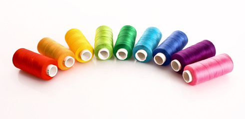 Few bobbins isolated on white