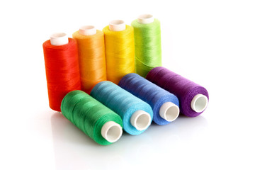 Few bobbins isolated on white