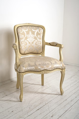 luxury armchair in a plain white interior