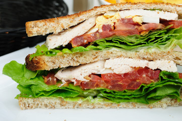 Sandwich with bacon - chicken, cheese and lettuce