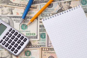 calculator, pens and pad