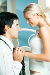 Naklejka premium Young attractive happy amorous couple at bedroom