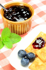 cracker and blueberry jam