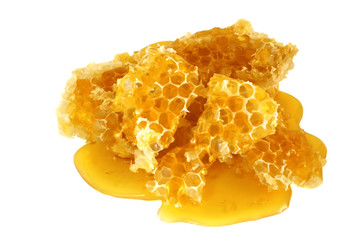 Honey in honeycombs isolated on white