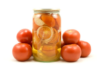 The clear glass jar of  pickled tomatoes on white