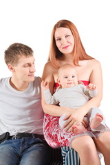 man and woman with baby is sitting on chair. isolated.