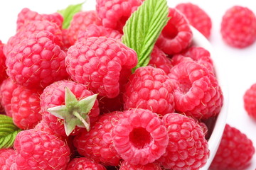 Crockery with  beautiful tempting raspberries.